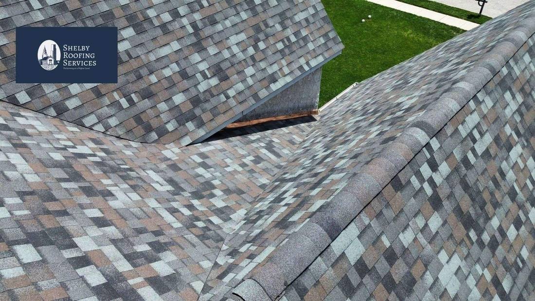 Hip and ridge cap shingles finishing the peaks of a new shingle roof by Shelby Roofing Services