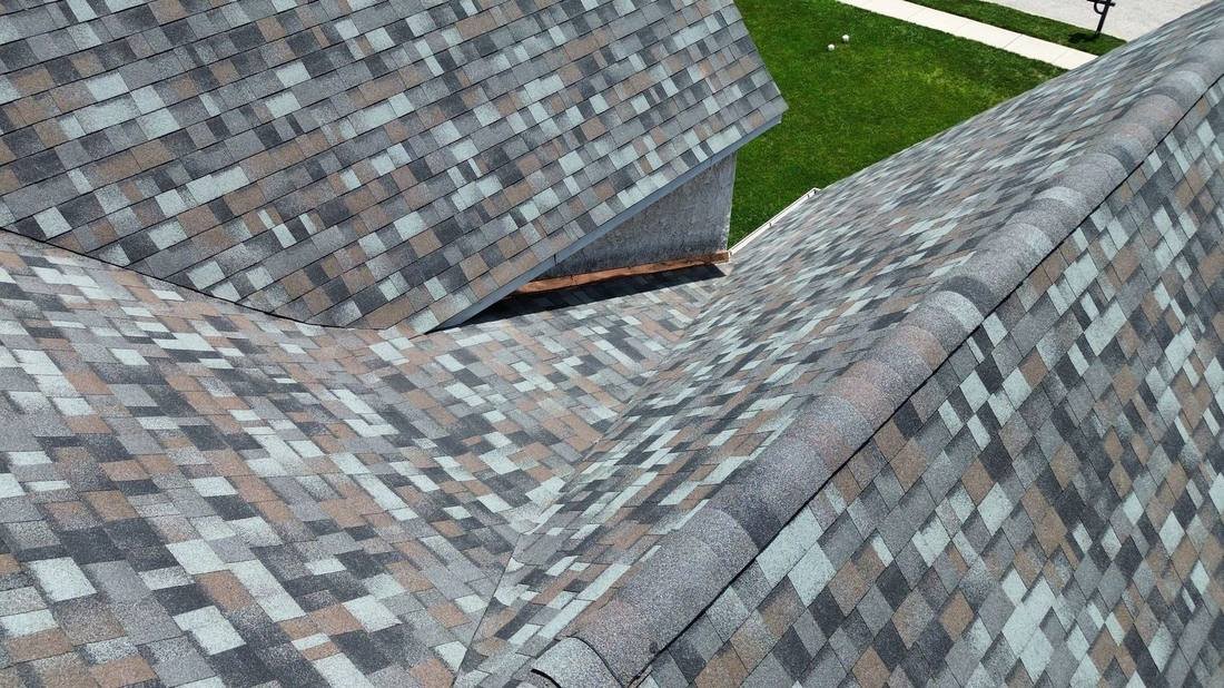 Closed shingle valleys and copper flashing where roof planes meet on a home completed by Shelby Roofing Services in Plymouth Township, PA