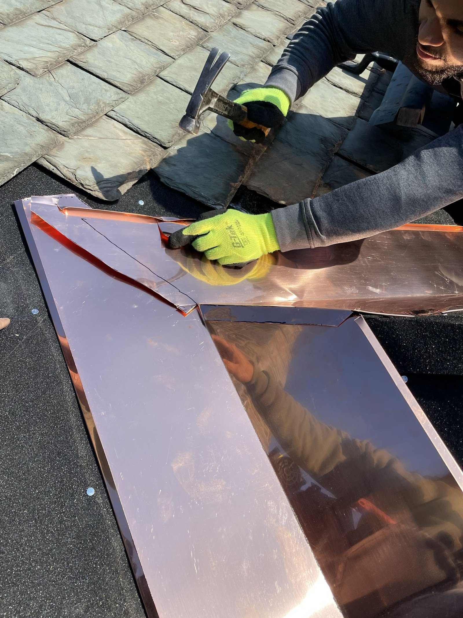 Miguel Cespedes installing custom copper valleys on a slate roof — precision craftsmanship, Greater Philadelphia Area