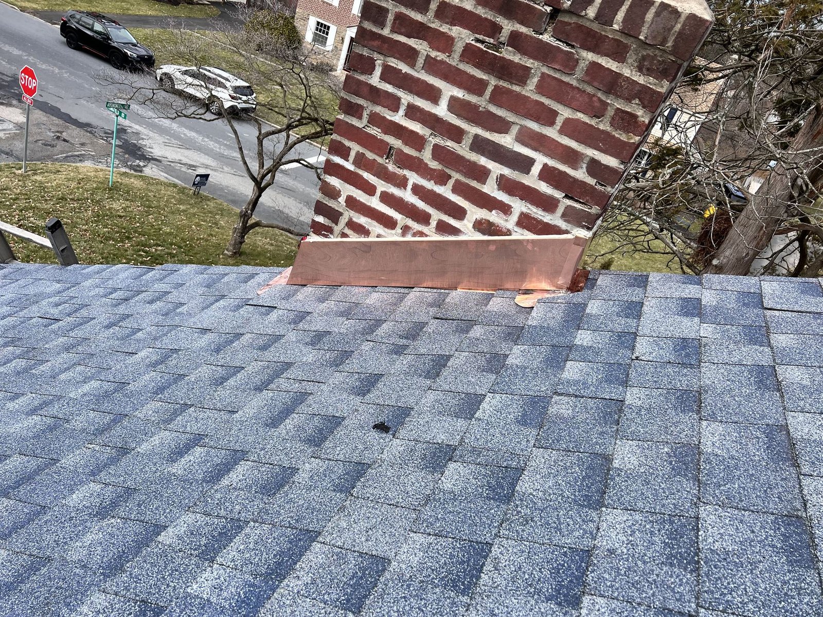 New copper chimney flashing detail on completed shingle roof — Shelby Roofing Services PA