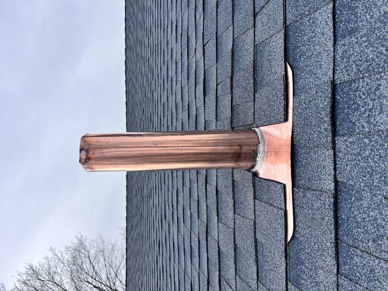 New copper pipe boot flashing on completed roof — Shelby Roofing Services PA
