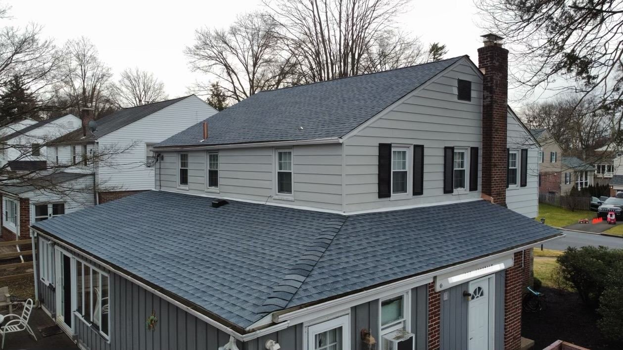 After — rear and side aerial view of completed charcoal shingle replacement — Shelby Roofing Services PA