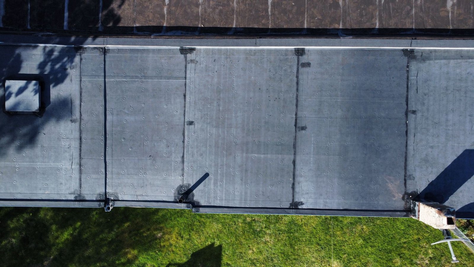 After — top-down view of new EPDM flat roof membrane sections — Shelby Roofing Services PA