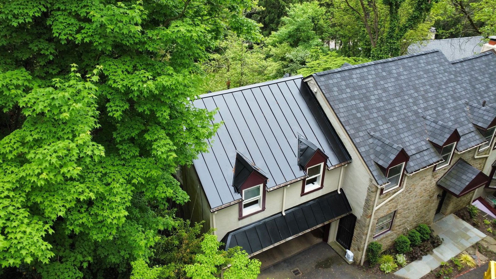 After — front aerial showing full home with new metal and slate-look shingle roof — Shelby Roofing Services PA
