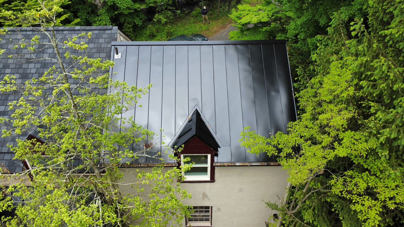 After — top-down aerial of completed standing seam metal roof on dormer section — Shelby Roofing Services PA