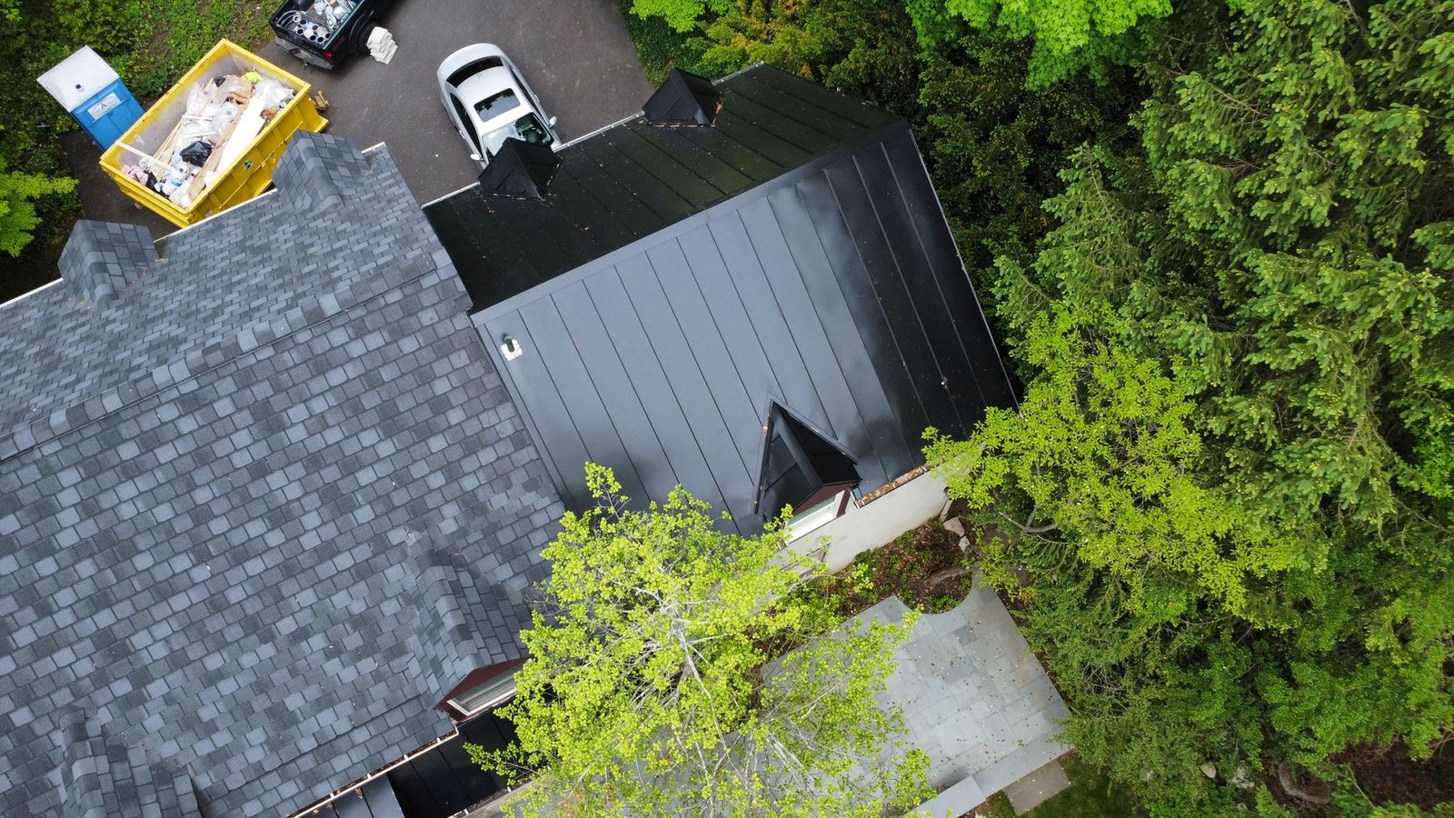 After — wide aerial showing completed standing seam metal and slate shingle combination — Shelby Roofing Services PA
