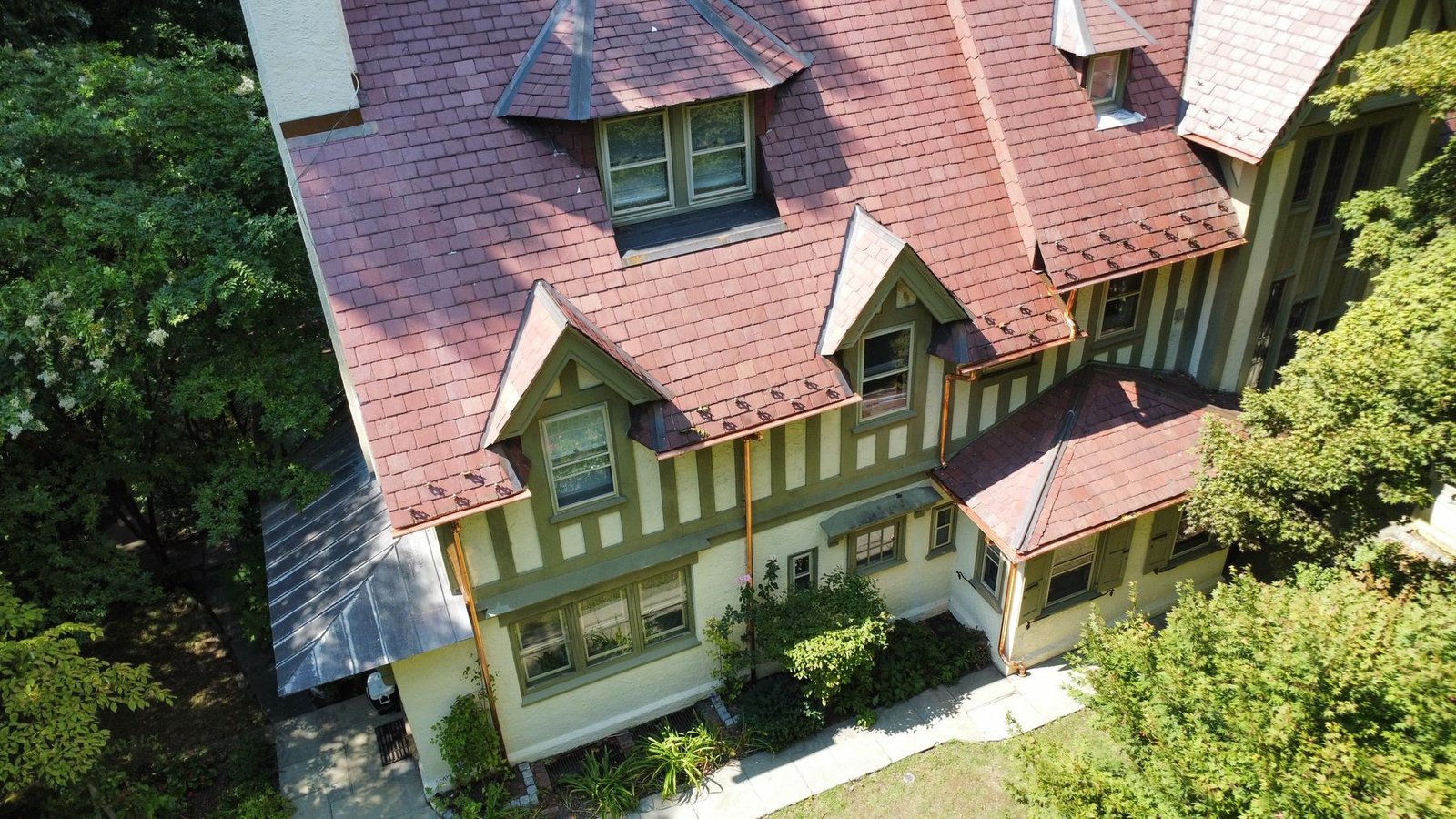 Completed — full aerial of historic Tudor estate with complete copper gutter system installed — Shelby Roofing Services PA