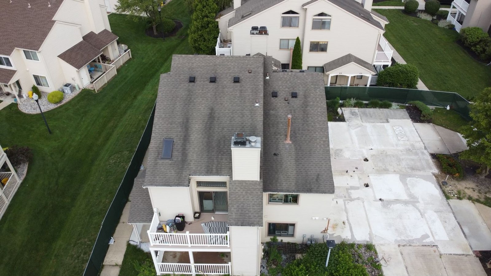 Before — wide aerial showing full condo complex extent of storm damage, PA