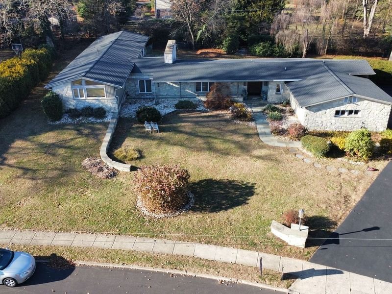 Stone ranch in Abington Township after a complete roof replacement — Shelby Roofing Services