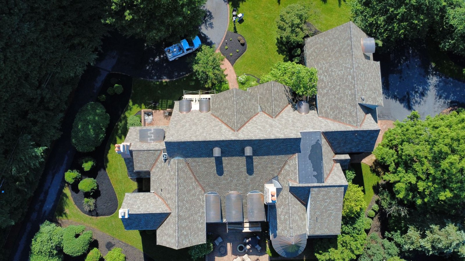 Aerial drone view of completed luxury estate shingle roof — Shelby Roofing Services Montgomery County PA