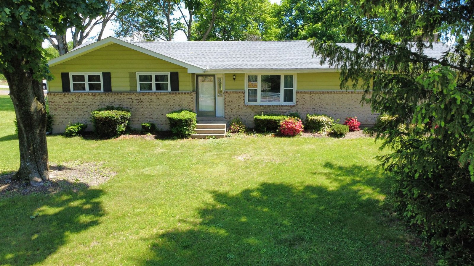 After — front aerial of ranch home with new charcoal shingles — Shelby Roofing Services PA