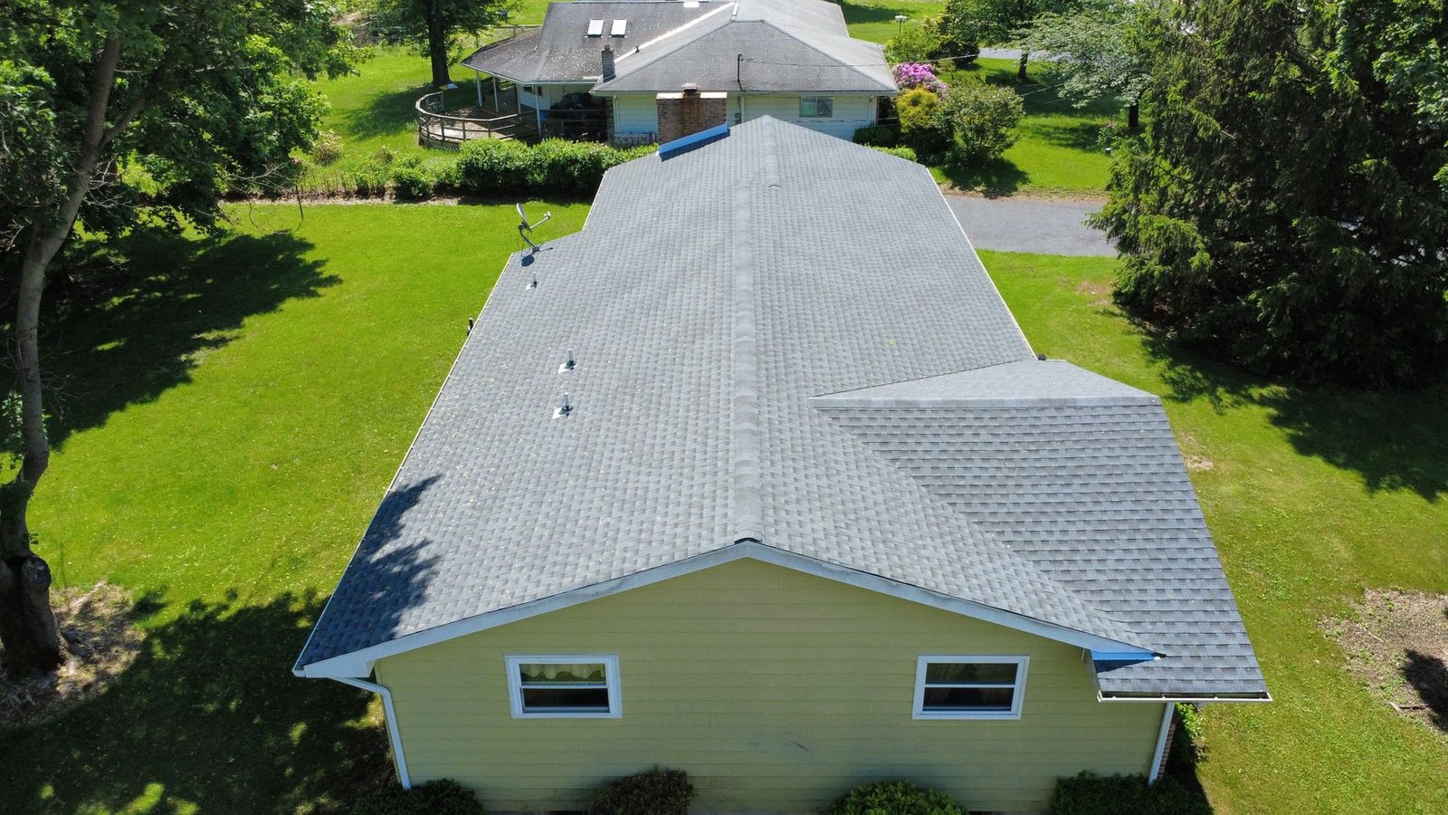 After — wide aerial of completed ranch property — Shelby Roofing Services PA