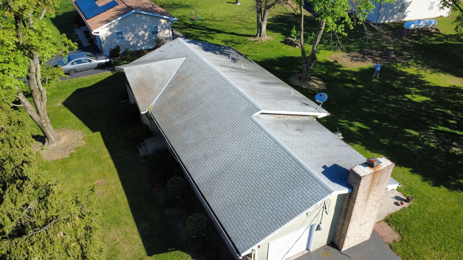 Before — top-down aerial of ranch home with old weathered gray shingles, PA