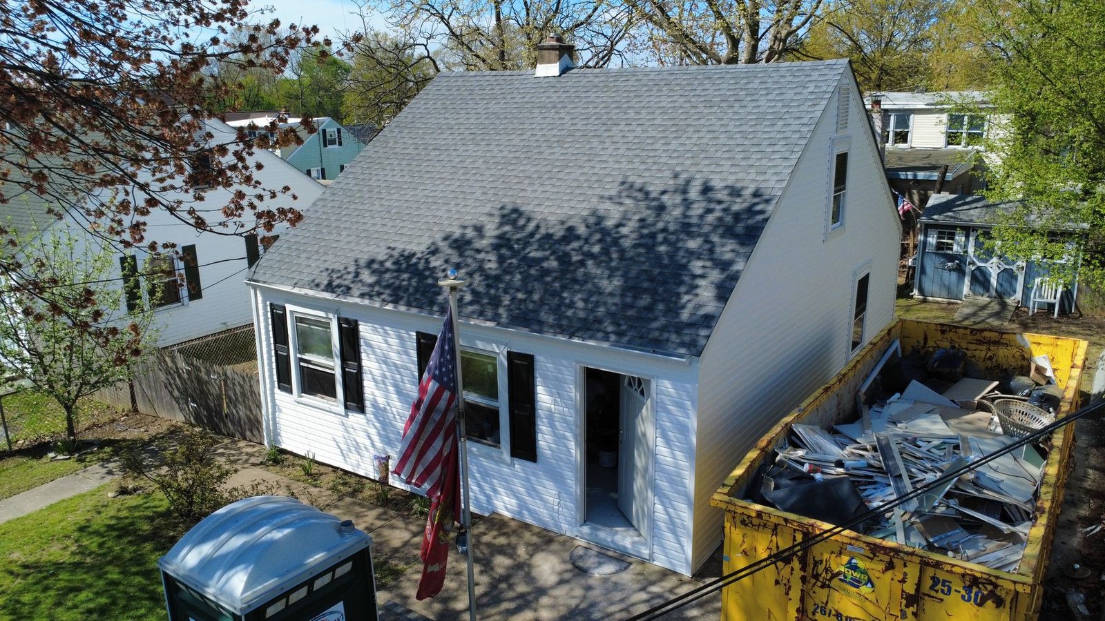 After — front of Cape Cod bungalow with new gray shingles — Shelby Roofing Services NJ