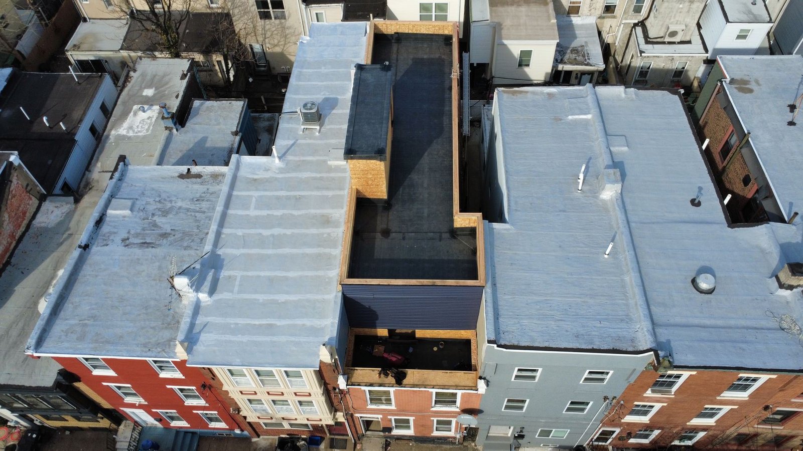 After — wide aerial of completed commercial flat roof — Shelby Roofing Services NJ