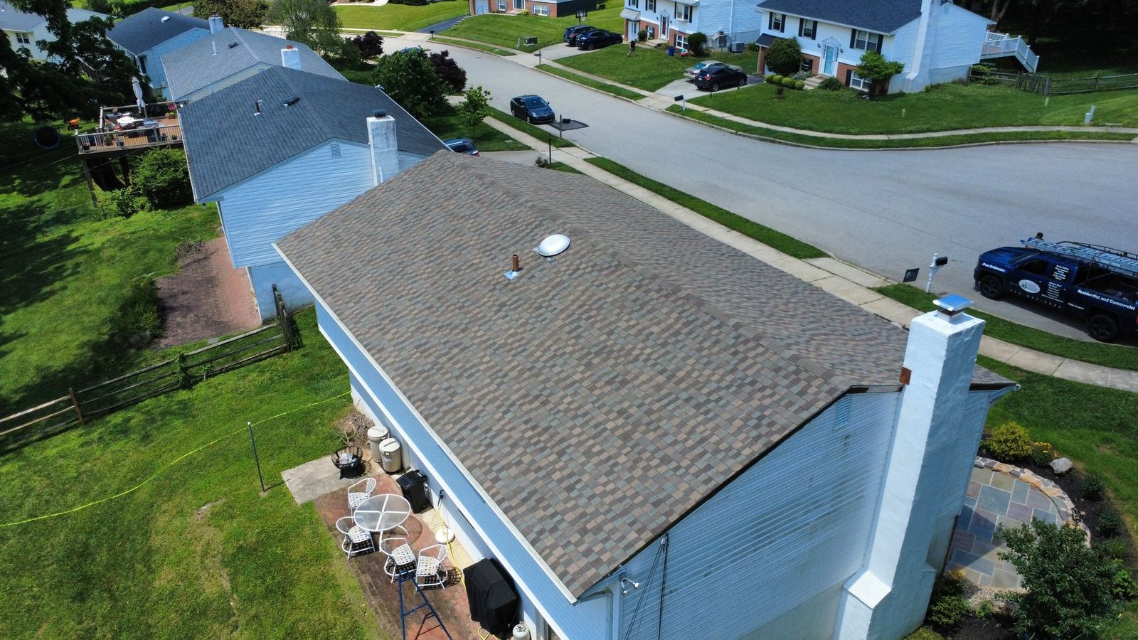 After — rear aerial of completed split-level — Shelby Roofing Services PA