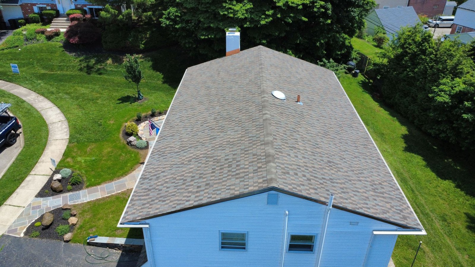 After — top-down aerial of completed split-level with new architectural shingles — Shelby Roofing Services PA