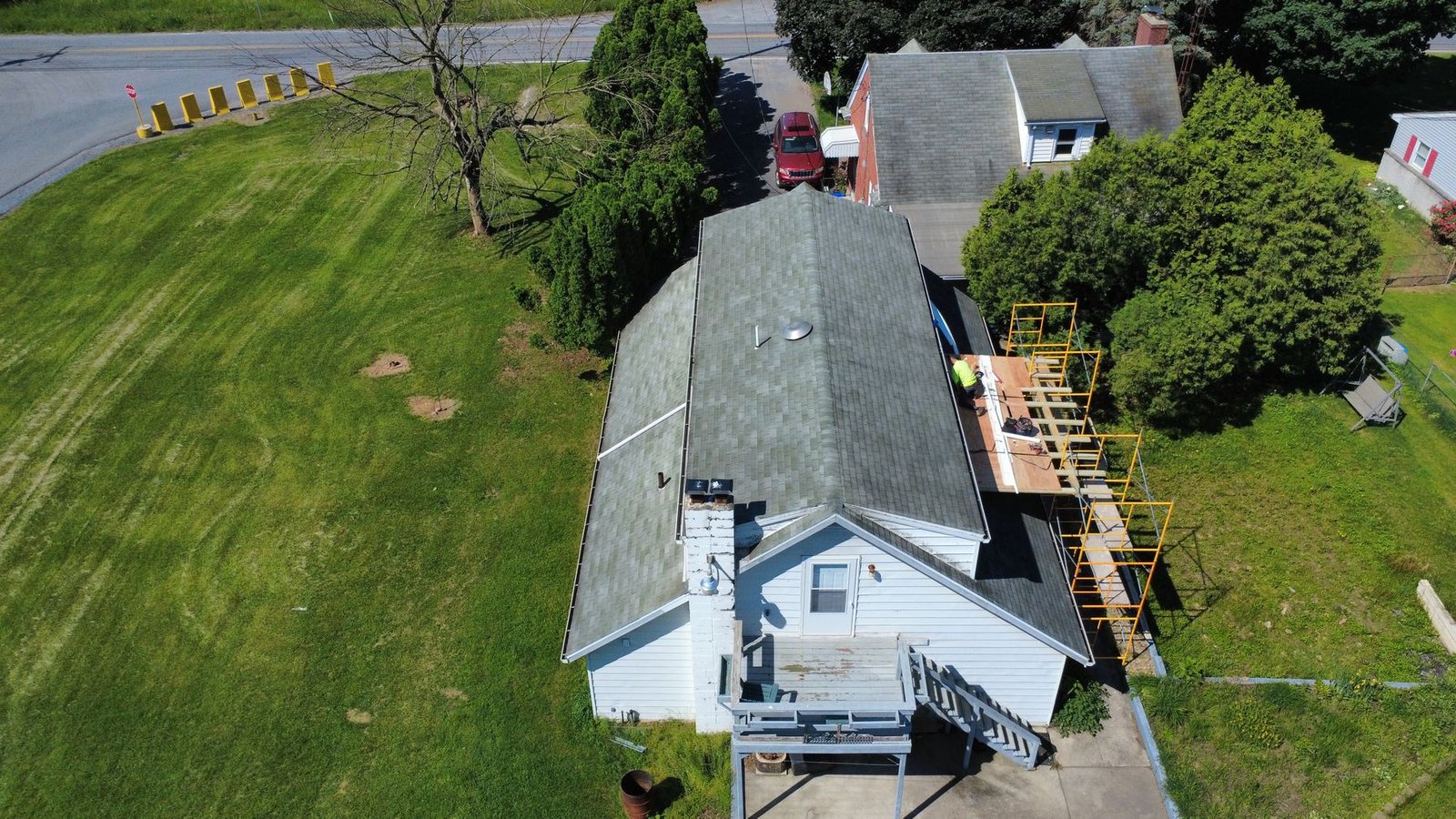 Before — aerial of white ranch with old weathered dark shingles, PA