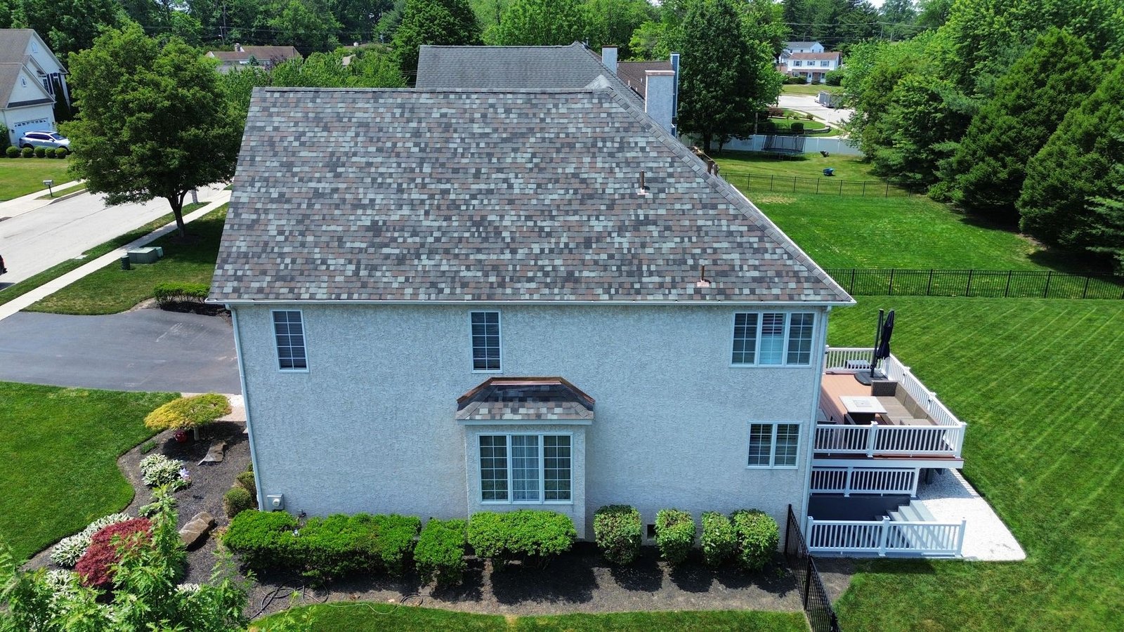After — aerial rear perspective showing completed roof with copper accents — Shelby Roofing Services PA