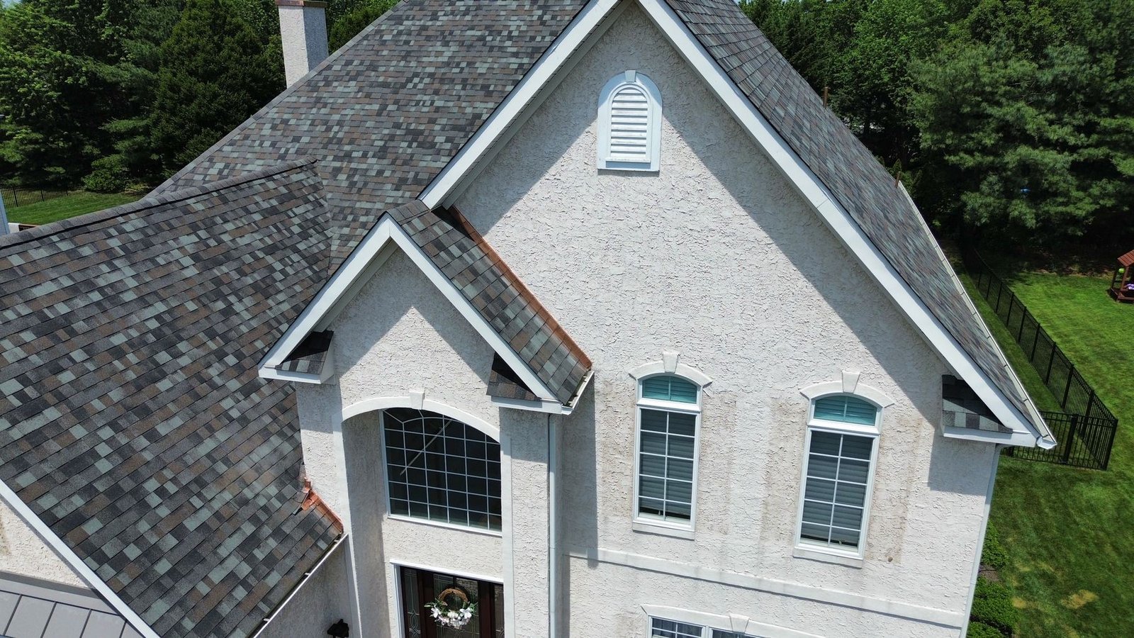 Close-up of new architectural shingles at peak and dormer — Shelby Roofing Services PA