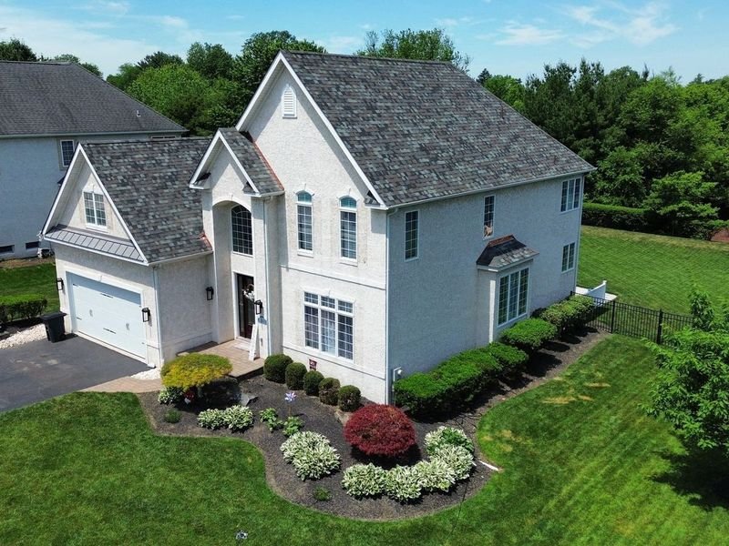 New shingle roof with a standing seam metal garage roof and copper details in Plymouth Township — Shelby Roofing Services