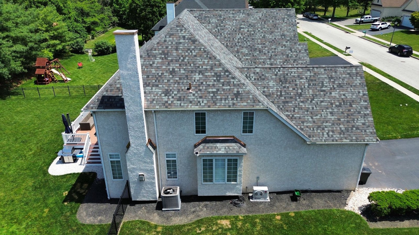 Drone aerial of completed shingle roof — rear-left perspective, Shelby Roofing Services PA