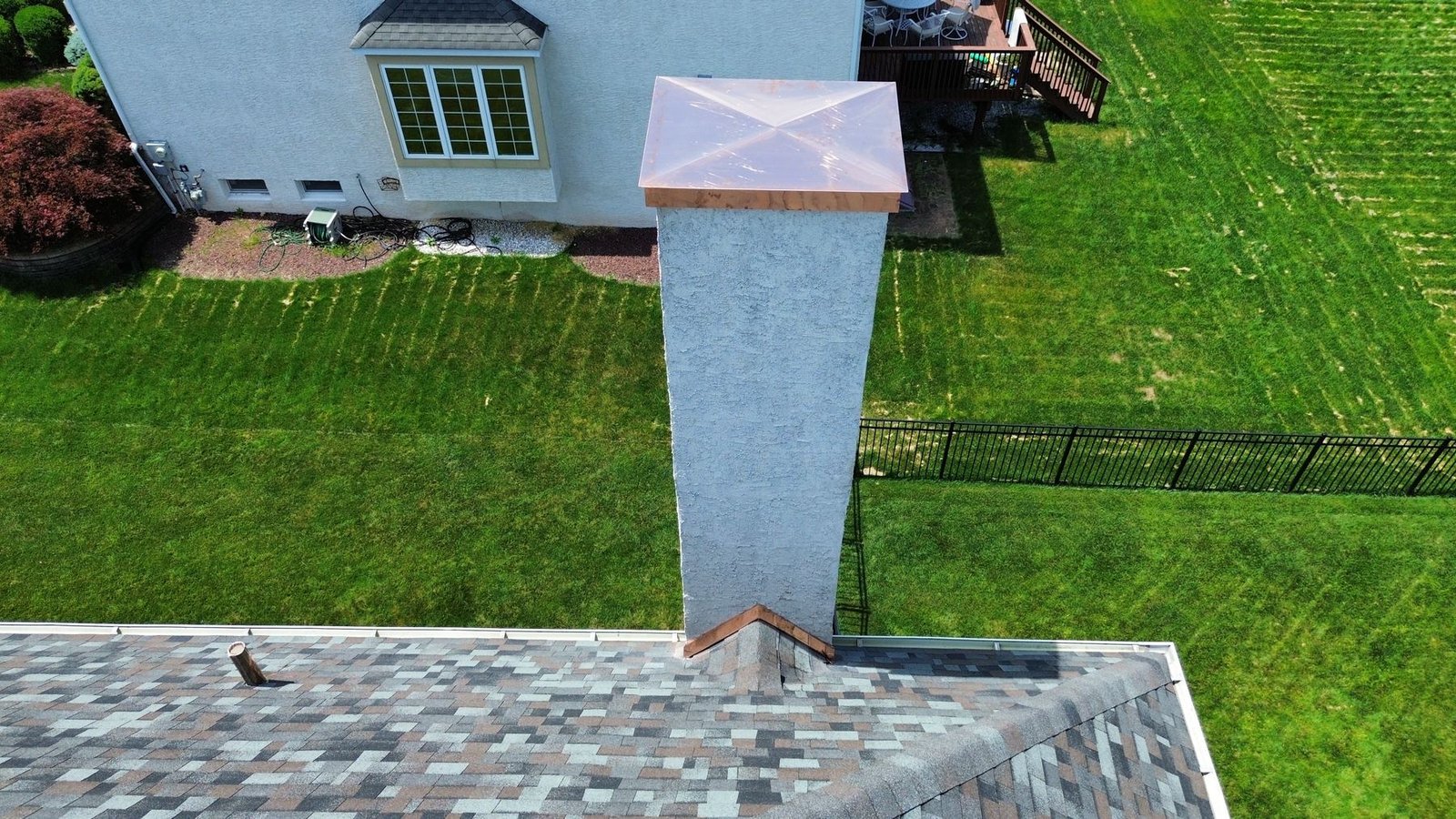 Aerial top-down view of chimney with new copper cap — Shelby Roofing Services PA