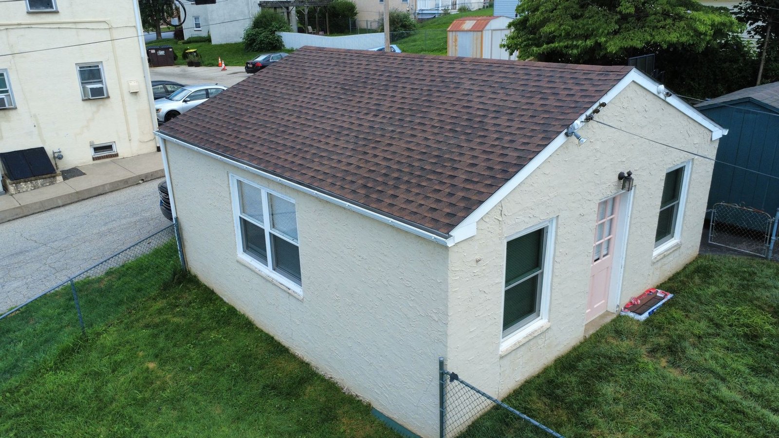 After — top-down view of completed rowhouse roof — Shelby Roofing Services PA
