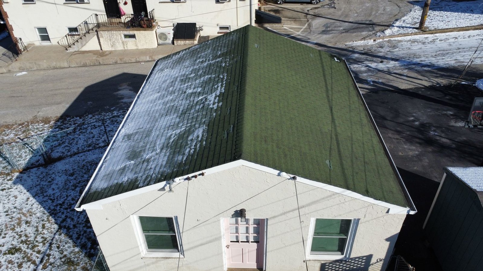 Before — aerial view of urban rowhouse with old shingles, PA