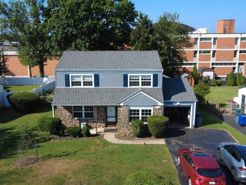 Stone colonial in Plymouth Meeting after a new roof and siding — Shelby Roofing Services
