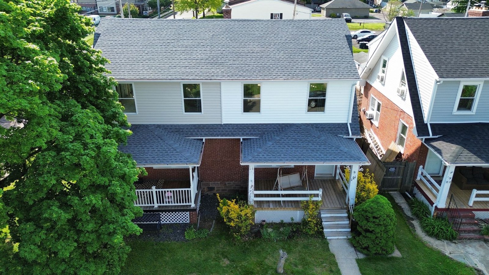 After — top-down aerial of completed semi-detached — Shelby Roofing Services PA