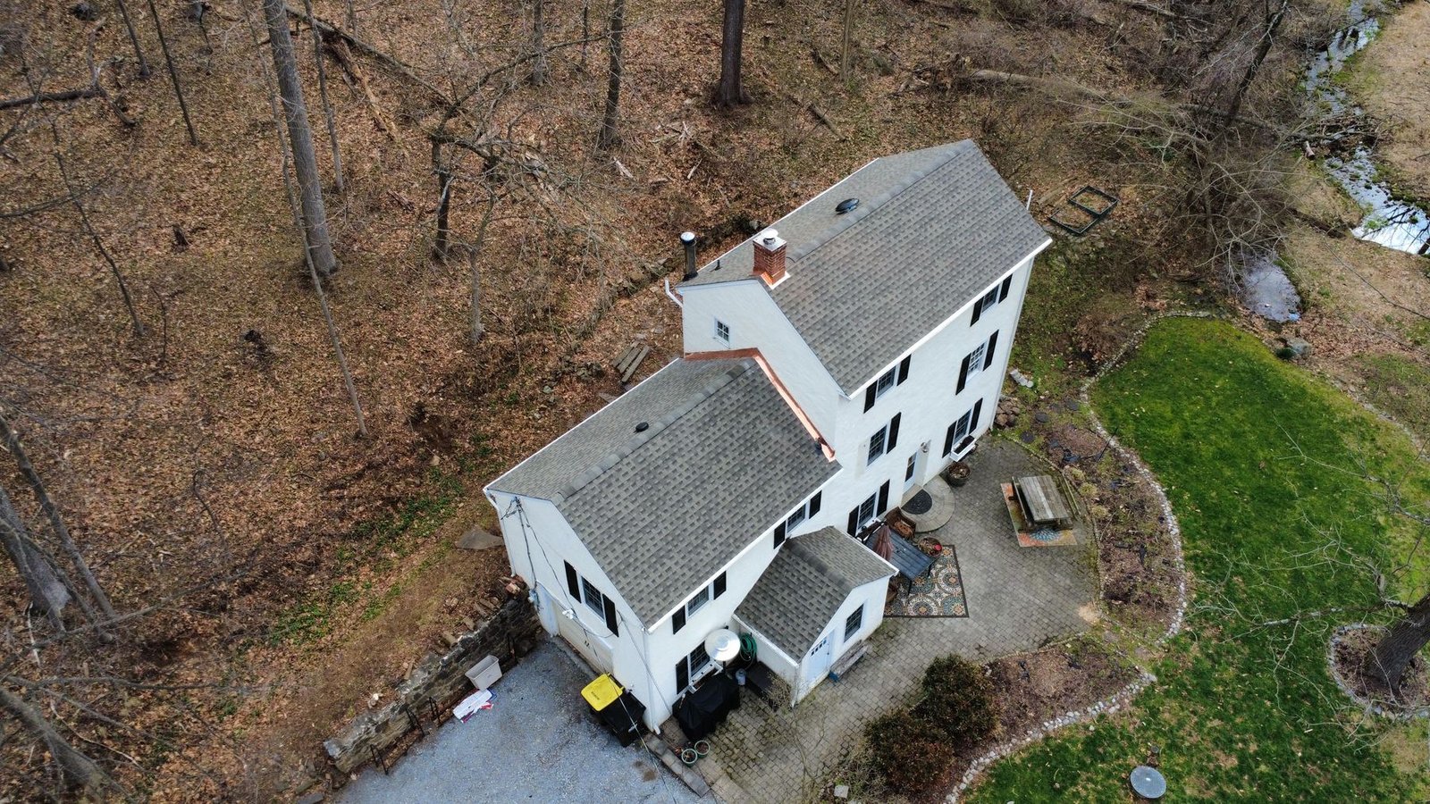 After — side aerial of completed cottage — Shelby Roofing Services PA