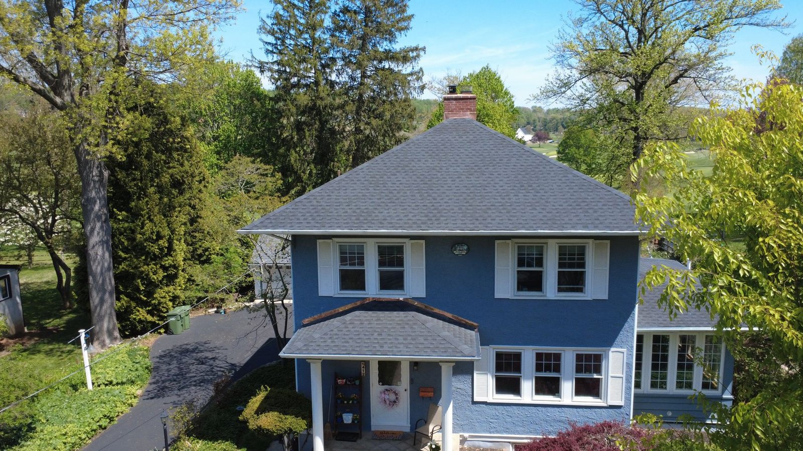 After — completed blue colonial with new premium charcoal shingles — Shelby Roofing Services PA