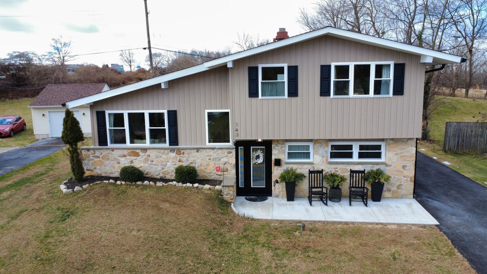 After — front aerial of completed ranch with new shingles and siding — Shelby Roofing Services PA