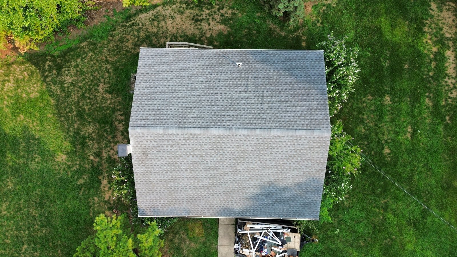 After — top-down aerial of completed roof with new gray architectural shingles, PA