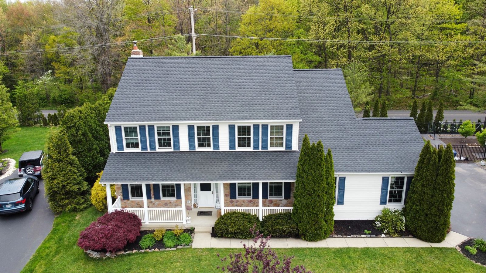 After — front aerial view with new charcoal architectural shingles — Shelby Roofing Services PA