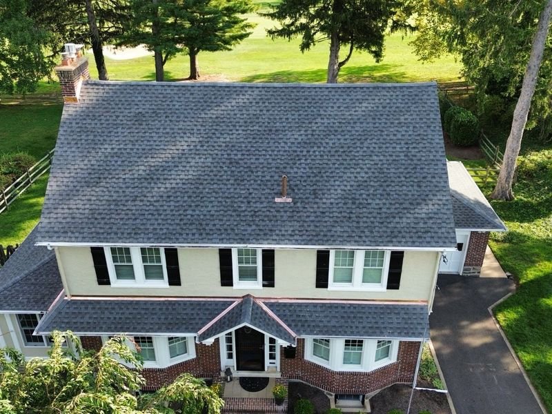 Colonial home in the Oreland section of Upper Dublin Township with a new shingle roof and copper flashing — Shelby Roofing Services