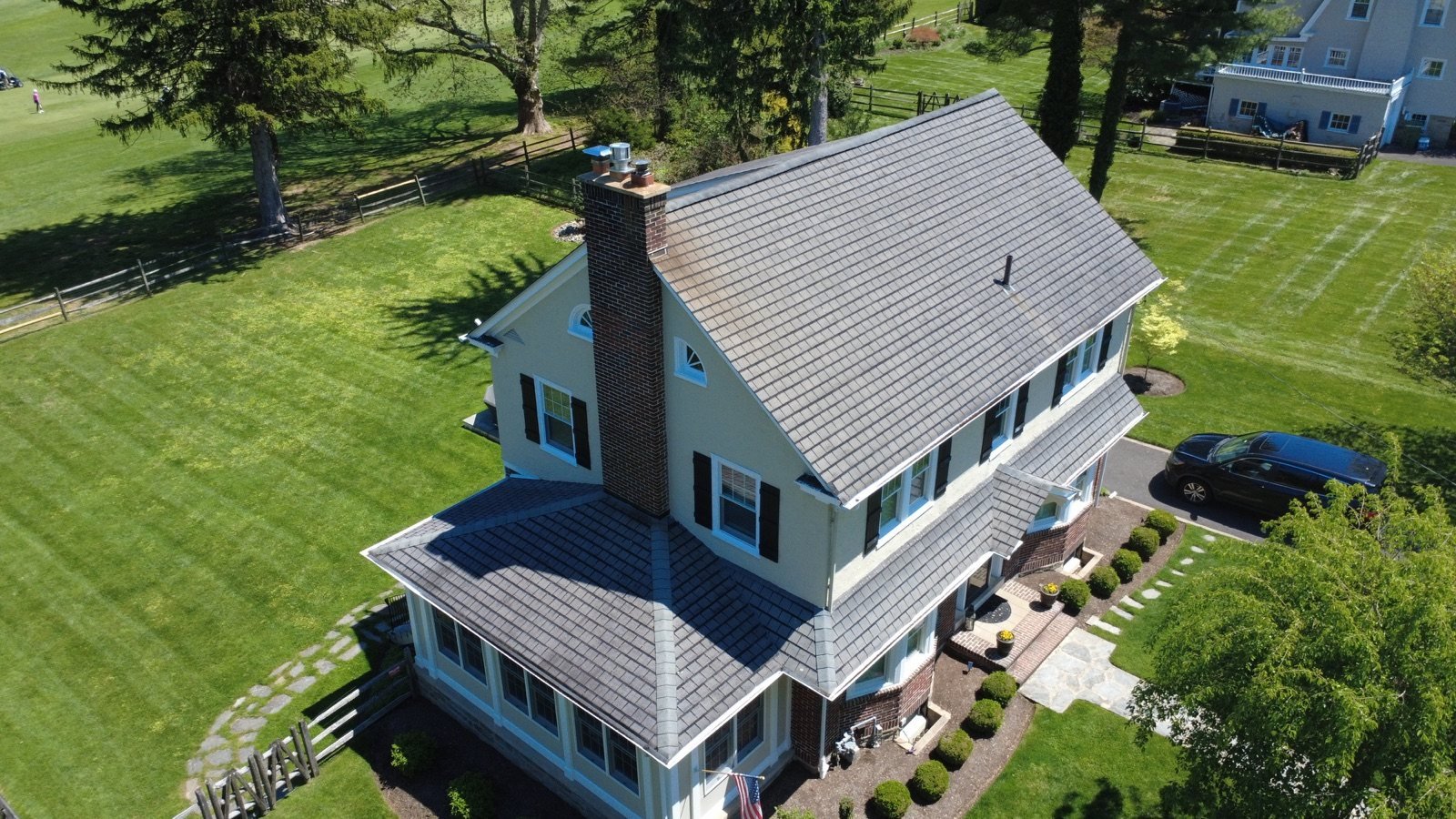 Before — chimney side aerial showing deteriorated, discolored shingles, PA