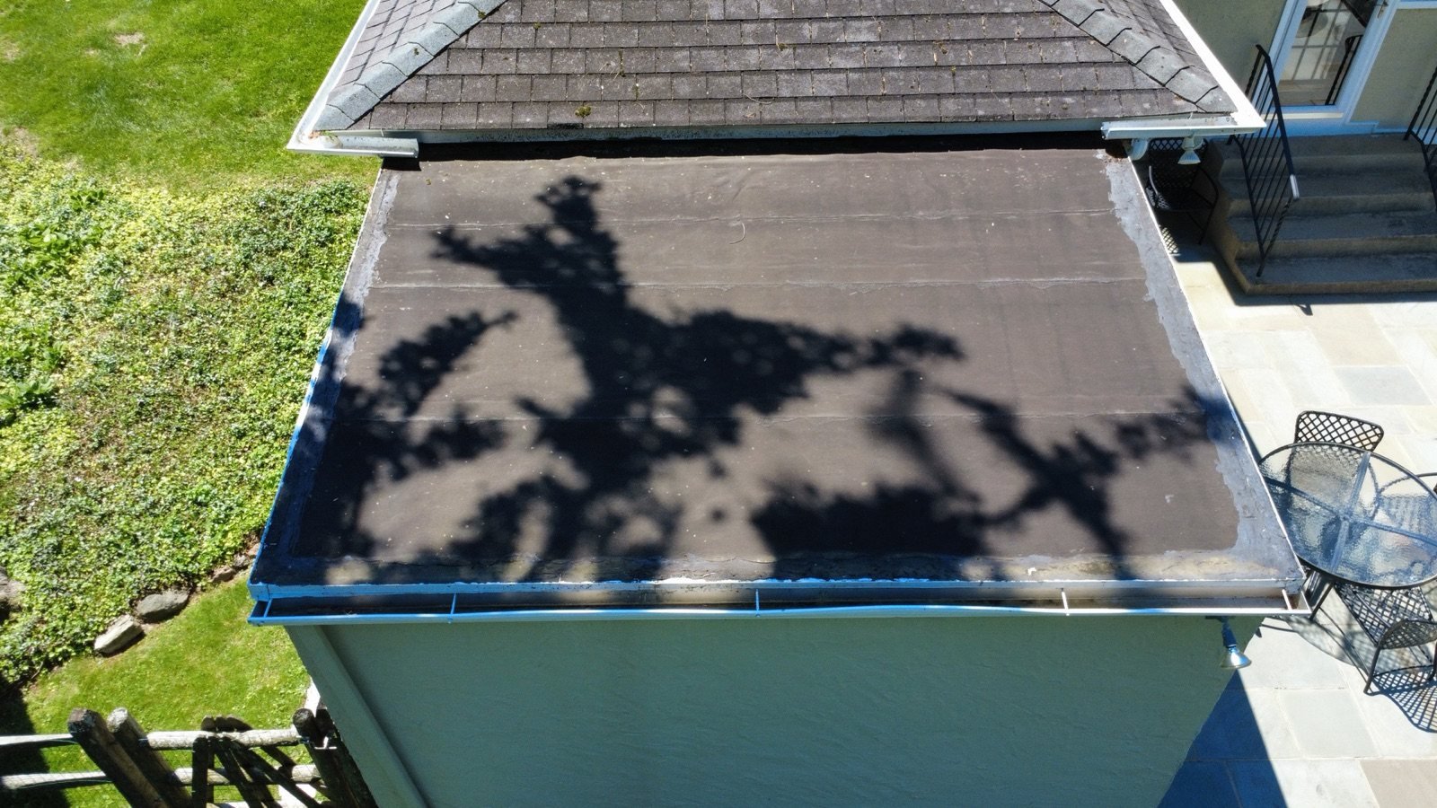 Before — rear addition flat roof with aged, failing surface, PA