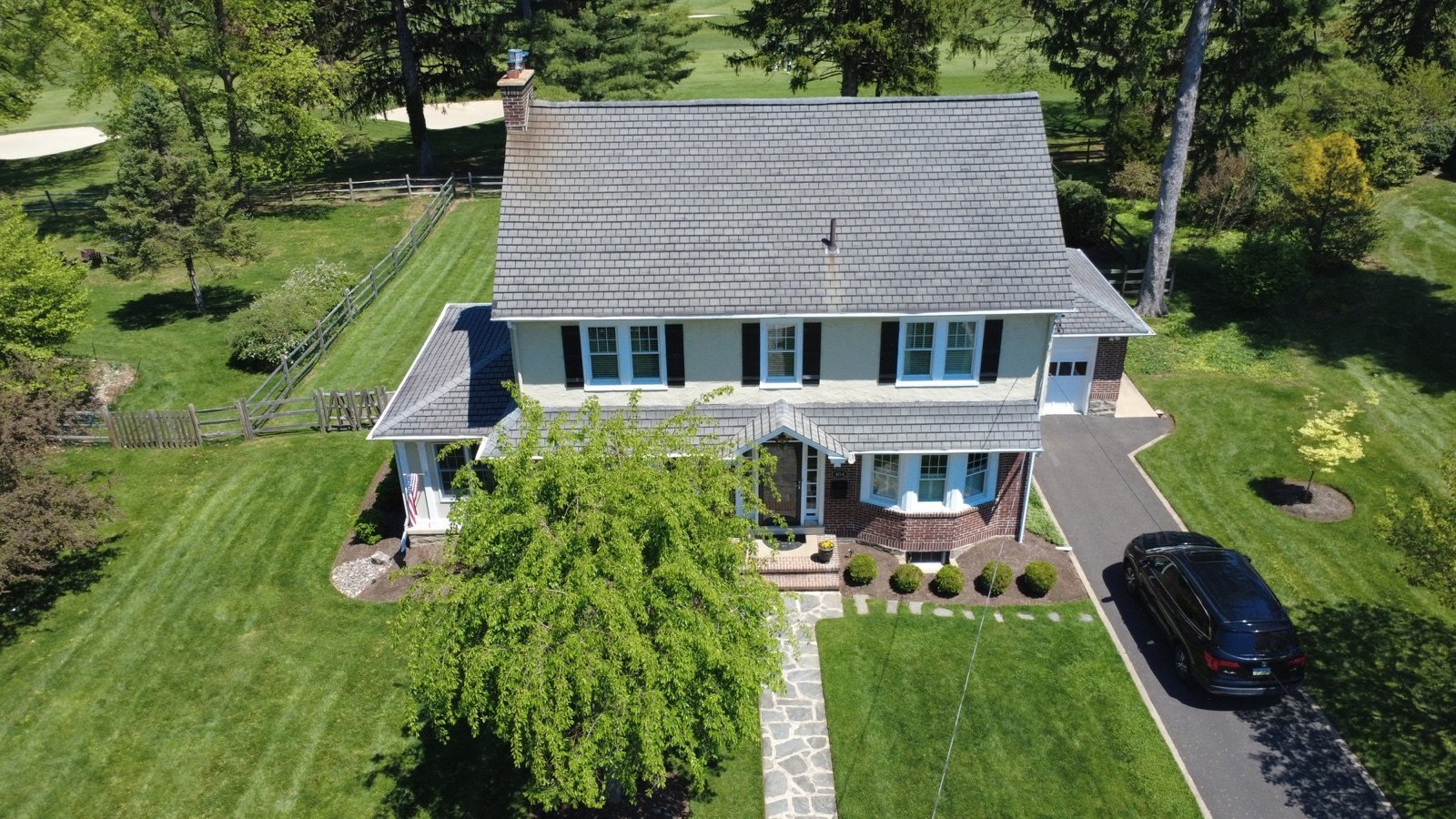Before — front aerial of colonial home with aged, weathered gray shingle roof, PA