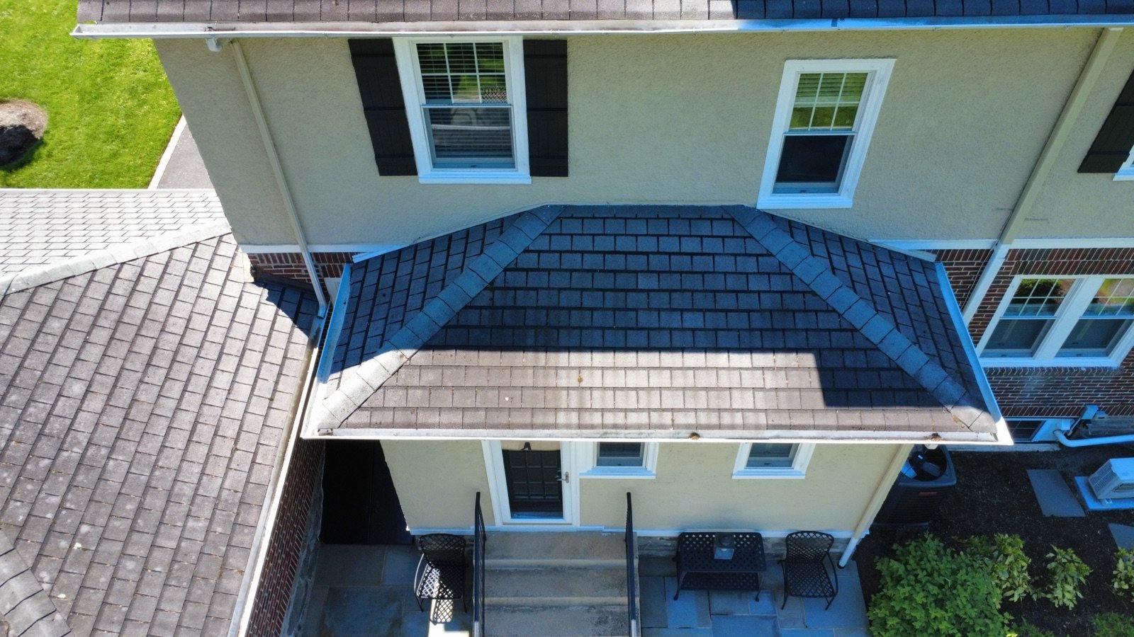 Before — rear entry hip roof with worn, stained shingles, PA