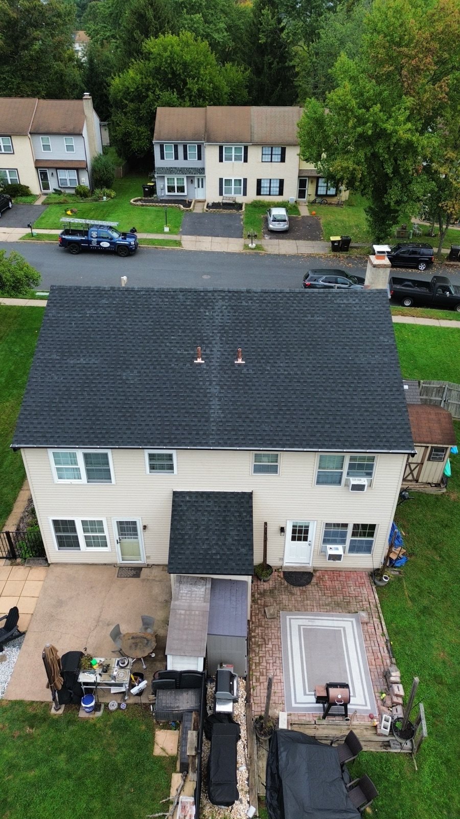 After — rear aerial of new black shingle roof with copper pipe flashing — Shelby Roofing Services PA