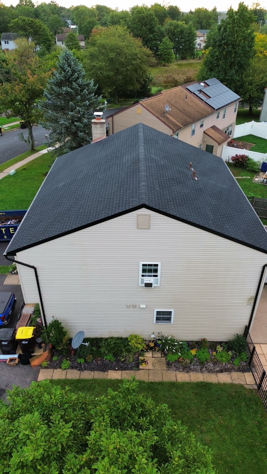 After — gable side aerial of new black shingle roof with black fascia and gutters — Shelby Roofing Services PA