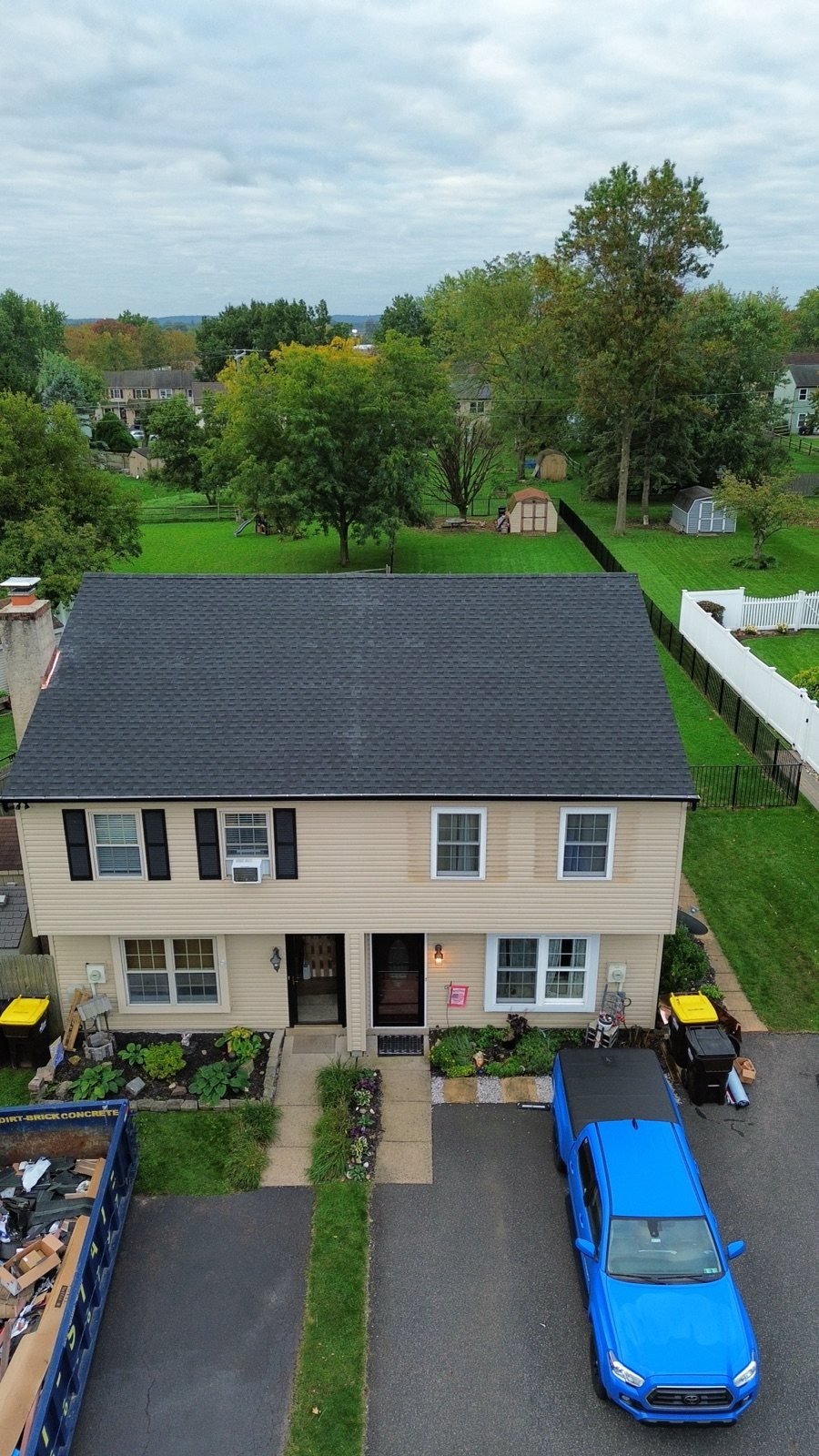 After — front view of completed home with new black roof, fascia and gutters — Shelby Roofing Services PA