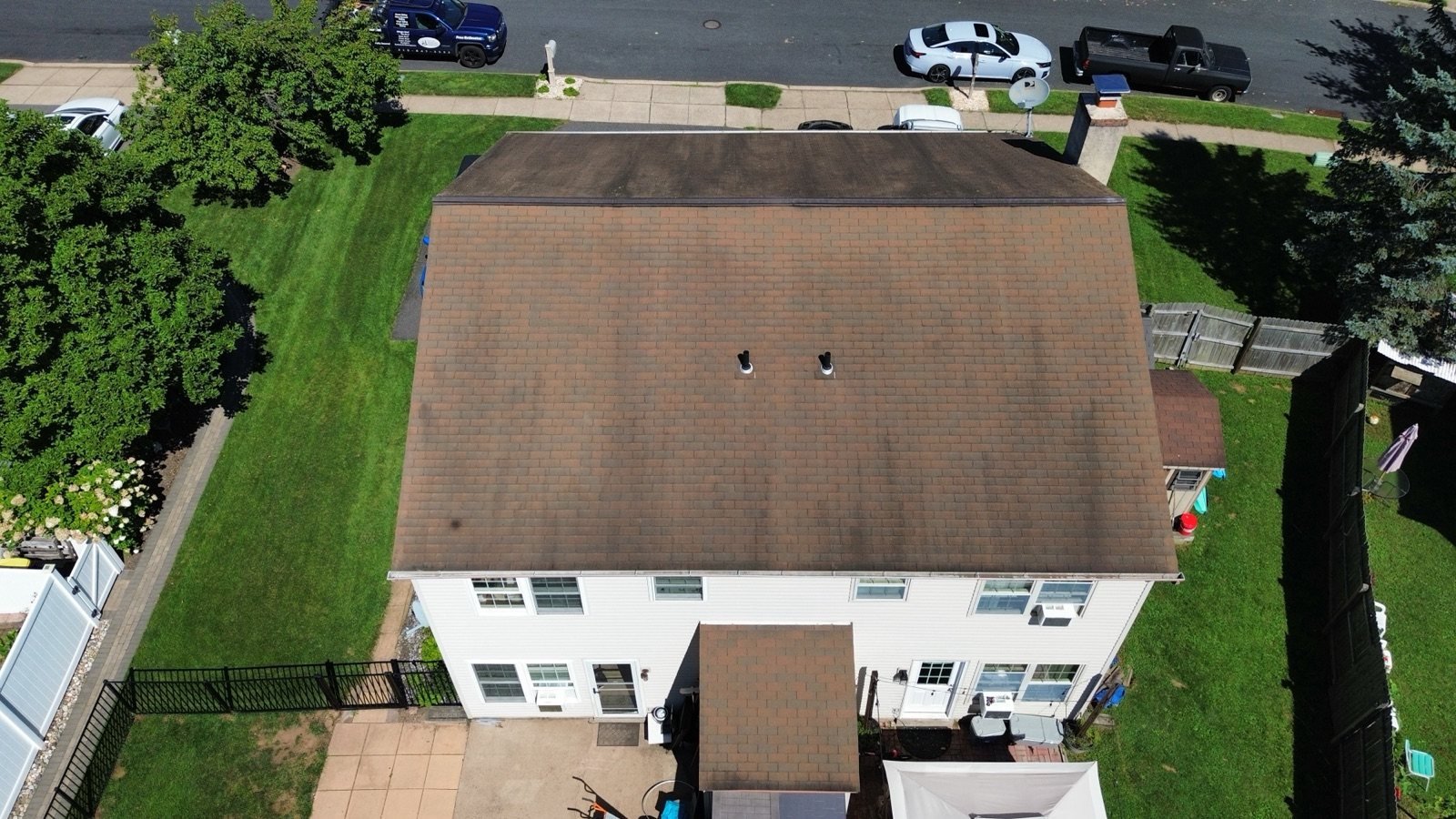 Before — rear aerial of weathered brown shingle roof, PA
