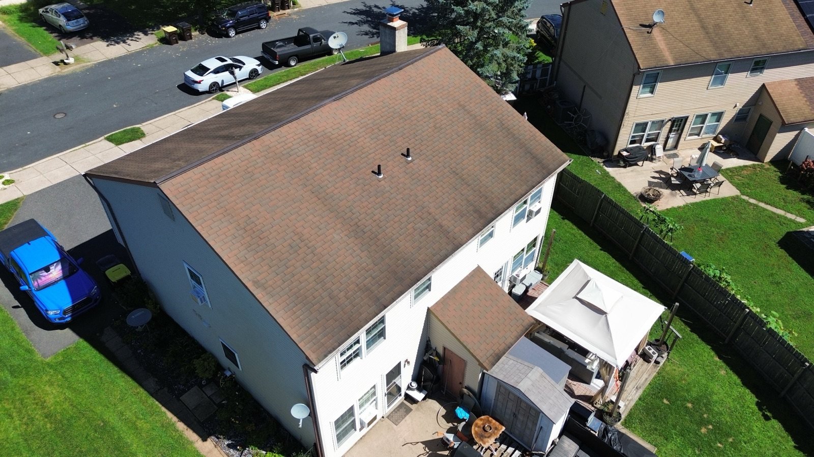 Before — rear corner aerial of faded brown shingle roof, PA