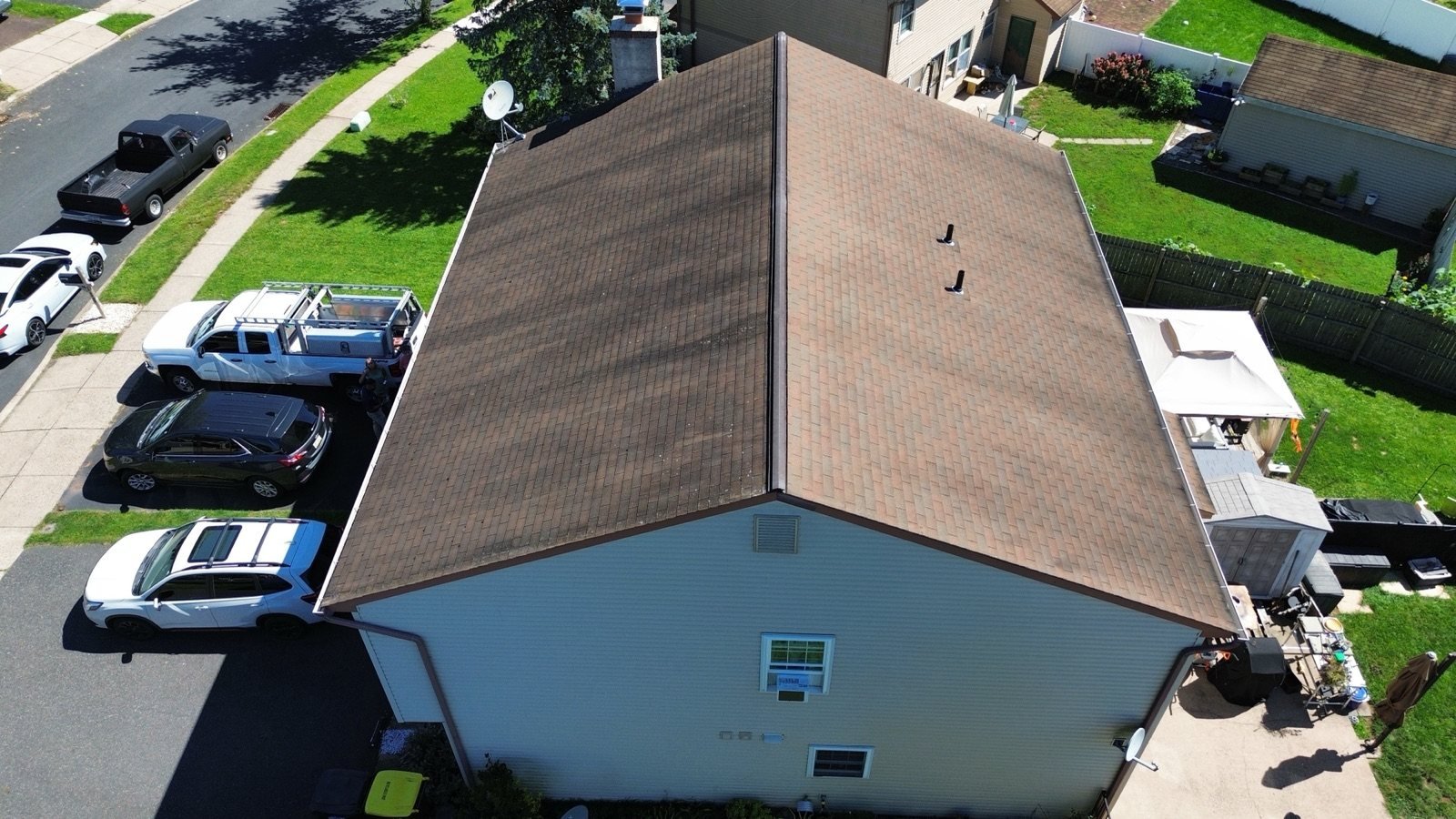Before — gable side aerial of aged brown shingle roof, PA