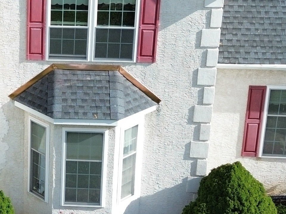 Copper counter flashing around the new shingle roof over the bay window, Plymouth Meeting PA — Shelby Roofing Services
