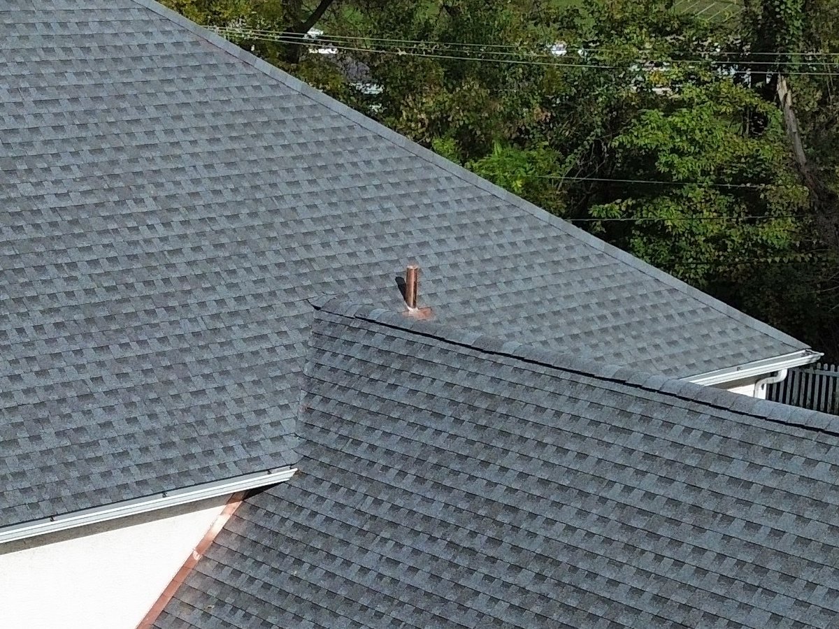 Custom-bent copper plumbing vent pipe flashing and copper counter flashing on the new shingle roof, Plymouth Meeting PA — Shelby Roofing Services
