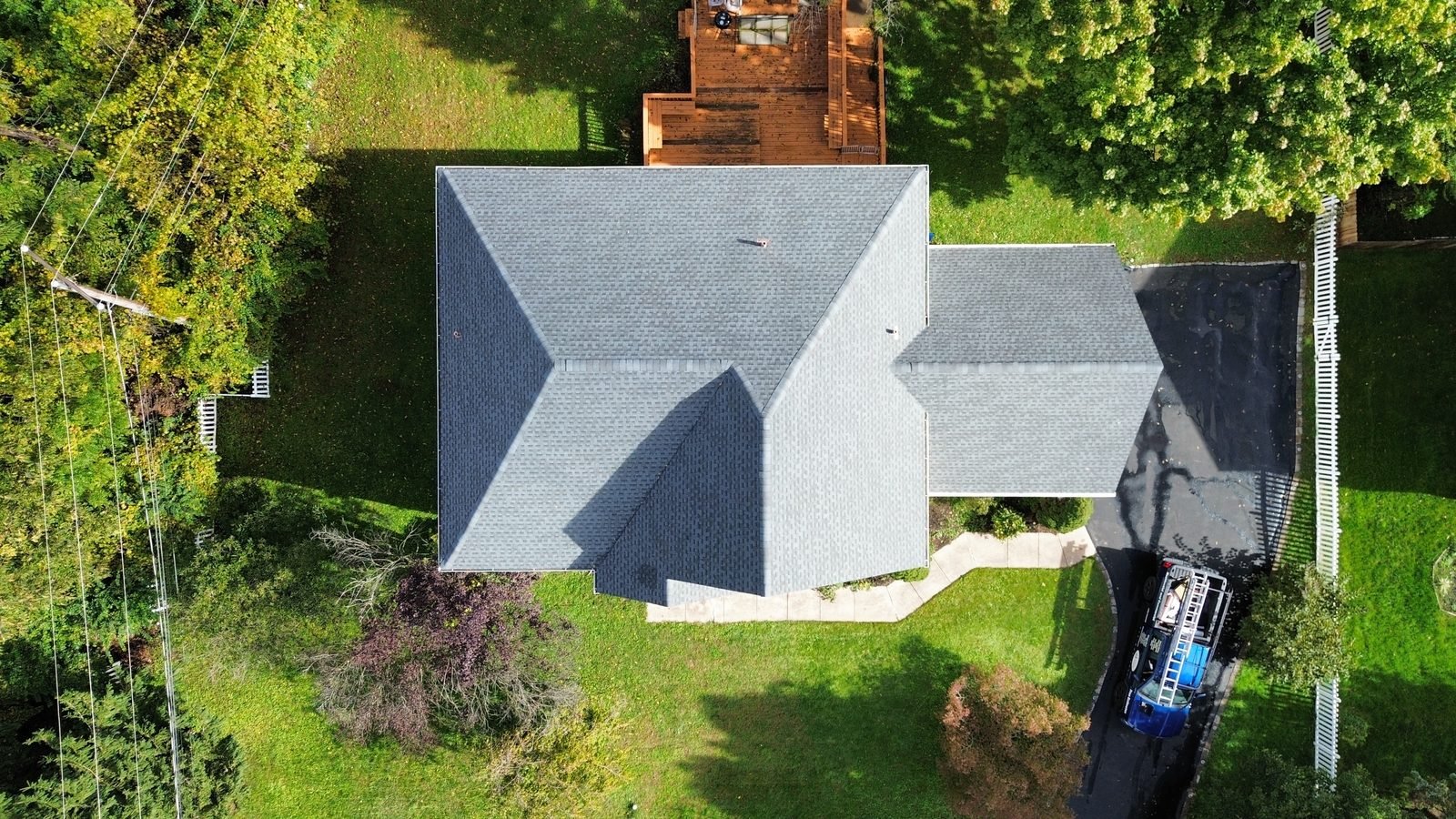 After — top-down aerial of the completed gray architectural shingle roof, hips and ridges, Plymouth Meeting PA — Shelby Roofing Services